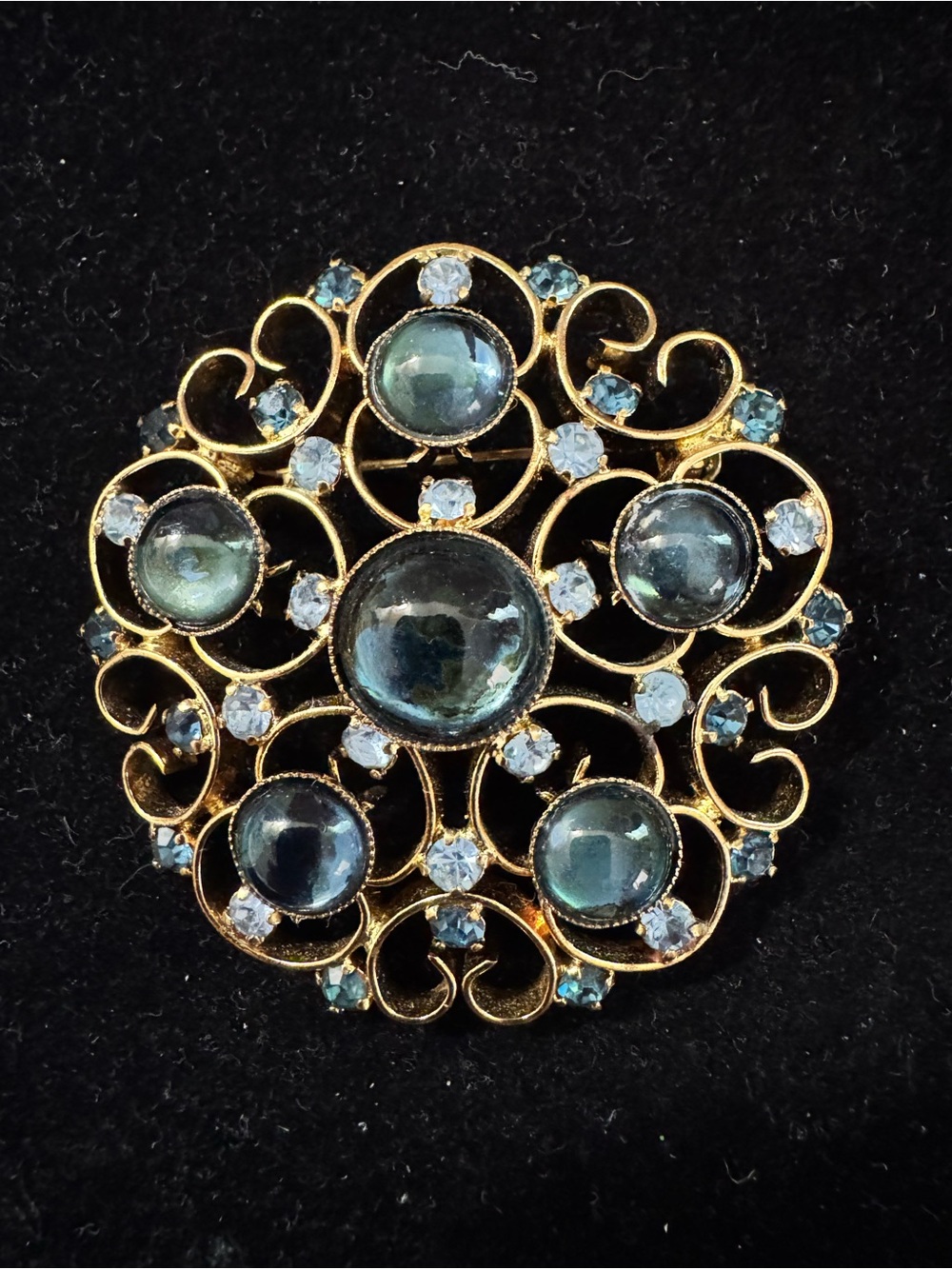 Vintage Gold Tone Scroll Brooch With Blue Cabochon Stones And Rhinestone Accents